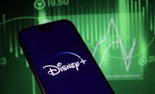 Disney+ logo over stocks background