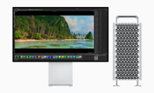 the 2023 apple mac pro with a tower closure next to an apple display