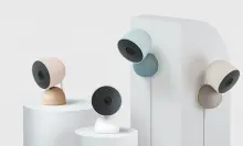 four google nest cameras in various colors