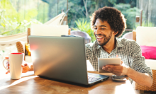 Young man using laptop in the living room