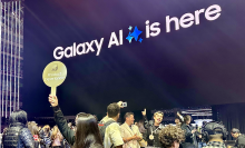 The Samsung Galaxy AI product experience surrounded by excited people.