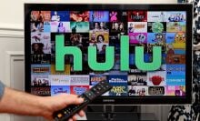 In this photo illustration, the Hulu media service provider's logo is displayed on the screen of a television.