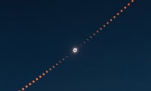 A composite image showing many phases of the eclipse with totality strikingly highlighted in the center