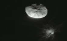 An image snapped by the LICIACube spacecraft as NASA's DART mission impacted the asteroid Dimorphos (on bottom right).