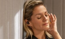 Woman wears a par of Google Pixel Buds Por`