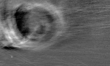 A "vortex-like structure" inside the sun's atmosphere caused by a coronal mass ejection interacting with the stellar environment.