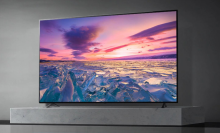 LG TV with water and sunset on screen