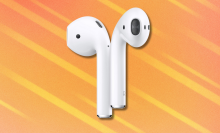 Apple AirPods on orange and white abstract background