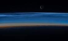 Noctilucent clouds hovering over Earth