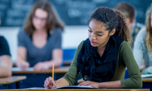 Writing An Exam - stock photo