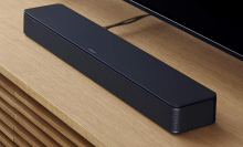 Bose soundbar on a brown entertainment center