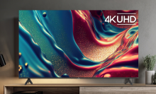 a tcl tv with an abstract background