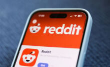 the reddit app on the screen of a smartphone