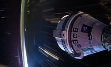 Boeing Starliner flying over Earth while docket at ISS