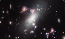 Gravitational lens distorting a galaxy cluster