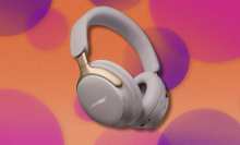 Bose QuietComfort Ultra headphones on orange and pink abstract background 