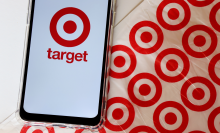 Bahia, Brazil - September 30, 2020.  Target Store logo on smartphone screen on top of Target shopping bag. Hypermarket. 