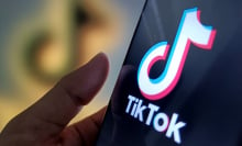 An illustration of the tiktok logo inside a phone