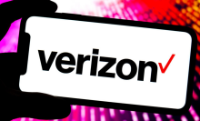 In this photo illustration, a Verizon logo is displayed on the screen of a smartphone.