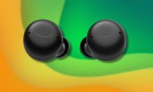 Amazon Echo Buds on green and yellow background