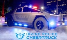 a police cybertruck lit up at night. 