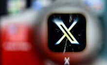 x logo blurred on a smartphone