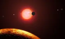 TRAPPIST-1 star system planets orbiting red dwarf star