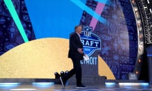 nfl commissioner roger goodell walking across the nfl draft stage