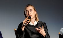 Saoirse ronan on stage, speaking into a microphone