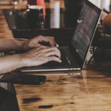 Person typing on the computer.