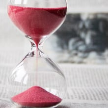 Hourglass with red sand