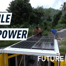 A mobile nanogrid with solar panels on the rooftop has stopped on a road near a forest. Caption reads" 'Mobile sun power."