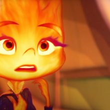 An animated girl made of flames stares shocked. 