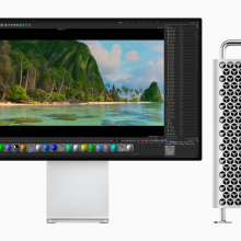 the 2023 apple mac pro with a tower closure next to an apple display