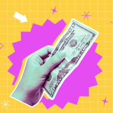 hand holding $50 in cash on a colorful background