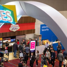 CES entry arch with people milling below