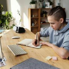 Boy studying in front of screen