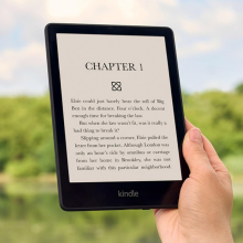 person holding kindle paperwhite 