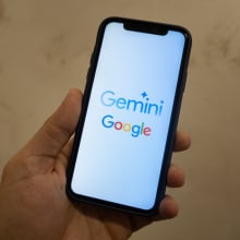 A smartphone showing the Goole and Gemini logos