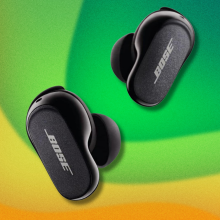 Bose QuietComfort Earbuds II on green and yellow abstract background