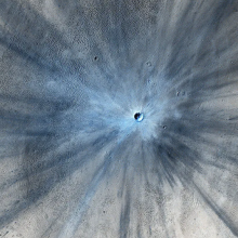 NASA's Mars Reconnaissance Orbiter captured an image of a fresh impact crater on Mars in 2013.