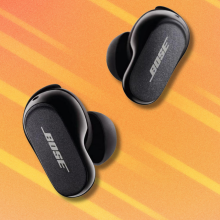 Bose QuietComfort Earbuds II on orange and white background