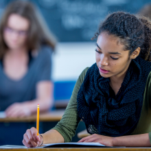 Writing An Exam - stock photo