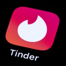 tinder logo displayed on smart phone