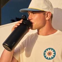 Man drinking out of Owala tumbler