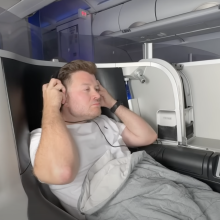 A man sitting in first class on an airplane