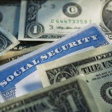 Studio shot of social security card and banknotes