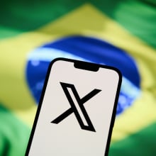 X logo and Brazil flag