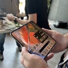 Man holding the Google Pixel 9 Pro Fold with both hands