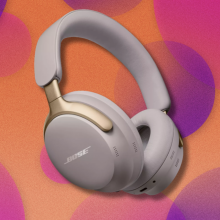 Bose QuietComfort Ultra headphones on orange and pink abstract background 